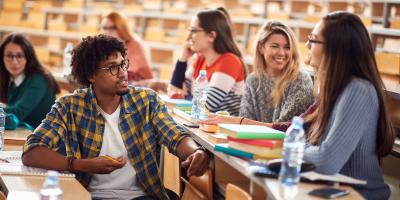 Young people talking in a lecture hall