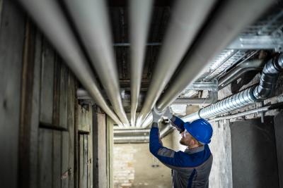 Man working on pipes