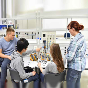Image of group of four, two men and two women, working in a lab